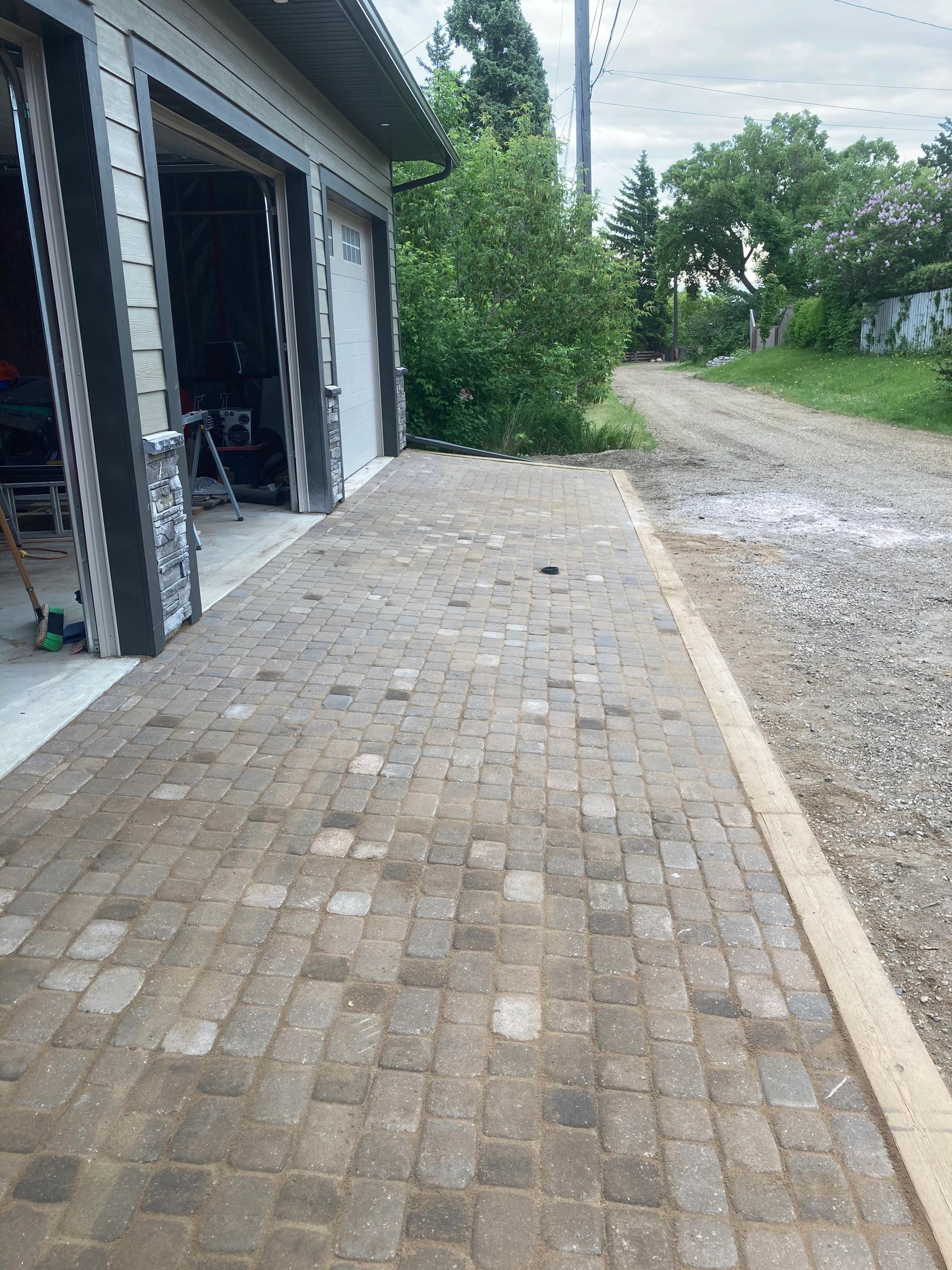 Lawn restoration in progress — before power raking in Morinville