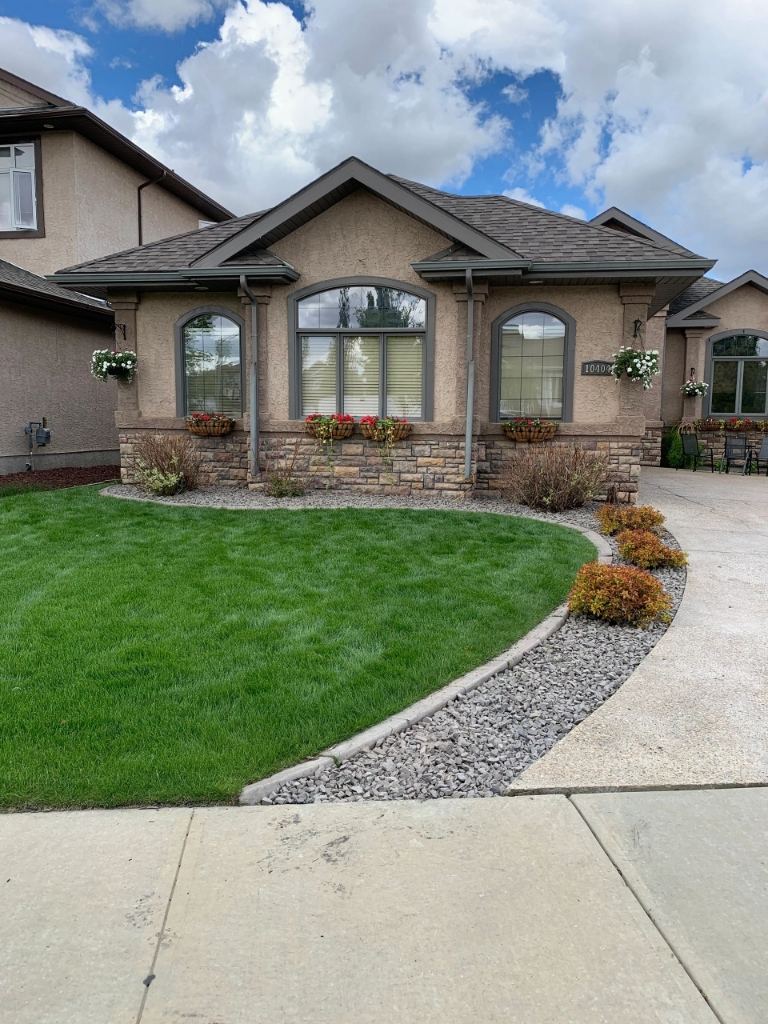 Lush summer-maintained lawn at a residential property in Morinville, Alberta