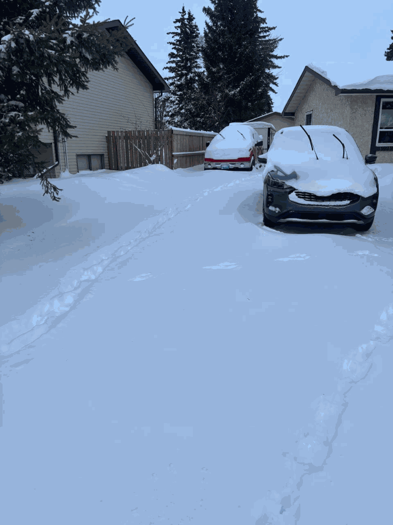 Driveway before snow clearing in Morinville after a major snowfall