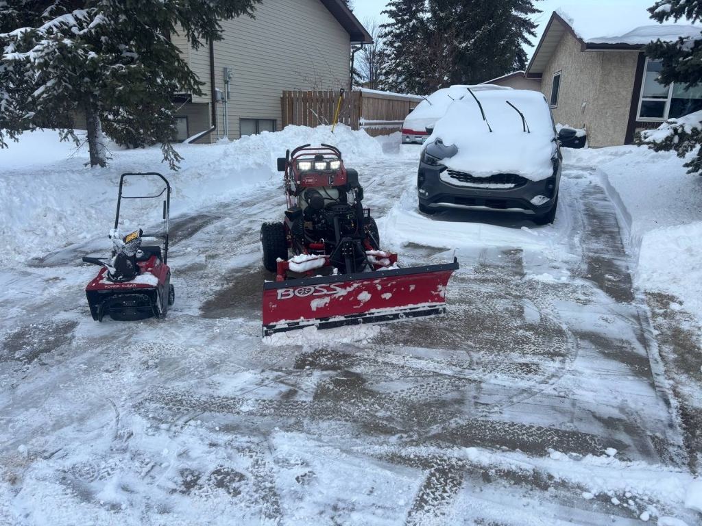Snow removal service for residential driveway in Morinville